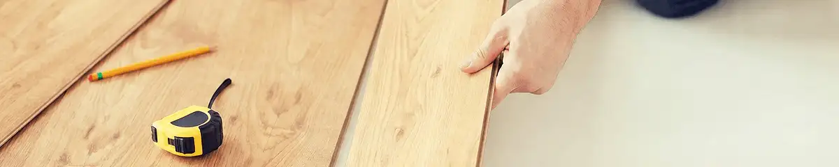 A professional installing wood flooring in Pembroke Pines, FL