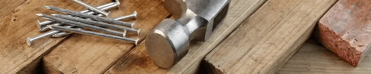 Hammer and nails on hardwood flooring boards in Pembroke Pines, FL