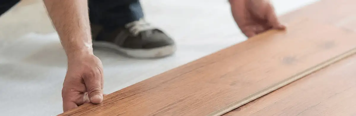 A professional installing laminate flooring in Pembroke Pines, FL