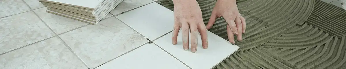 Professional installing white tile floors in Pembroke Pines, FL