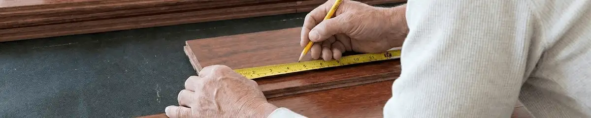 A professional installing wood flooring in Pembroke Pines, FL